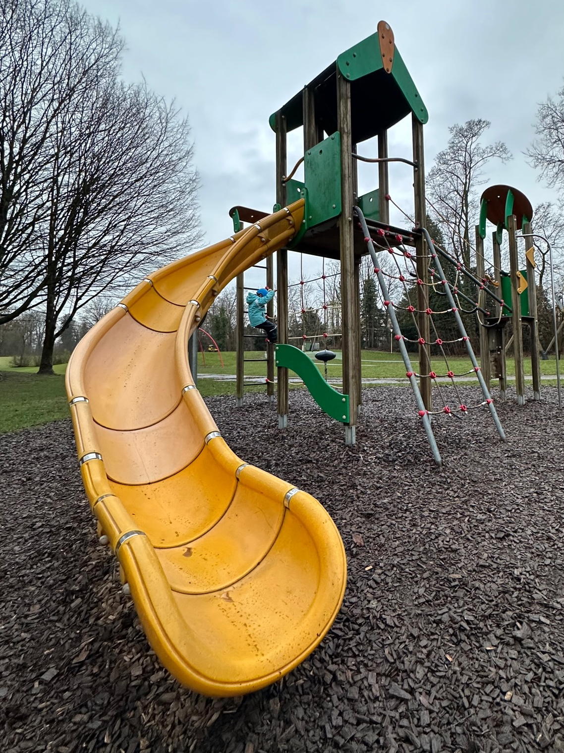 Big yellow slide on the playground.