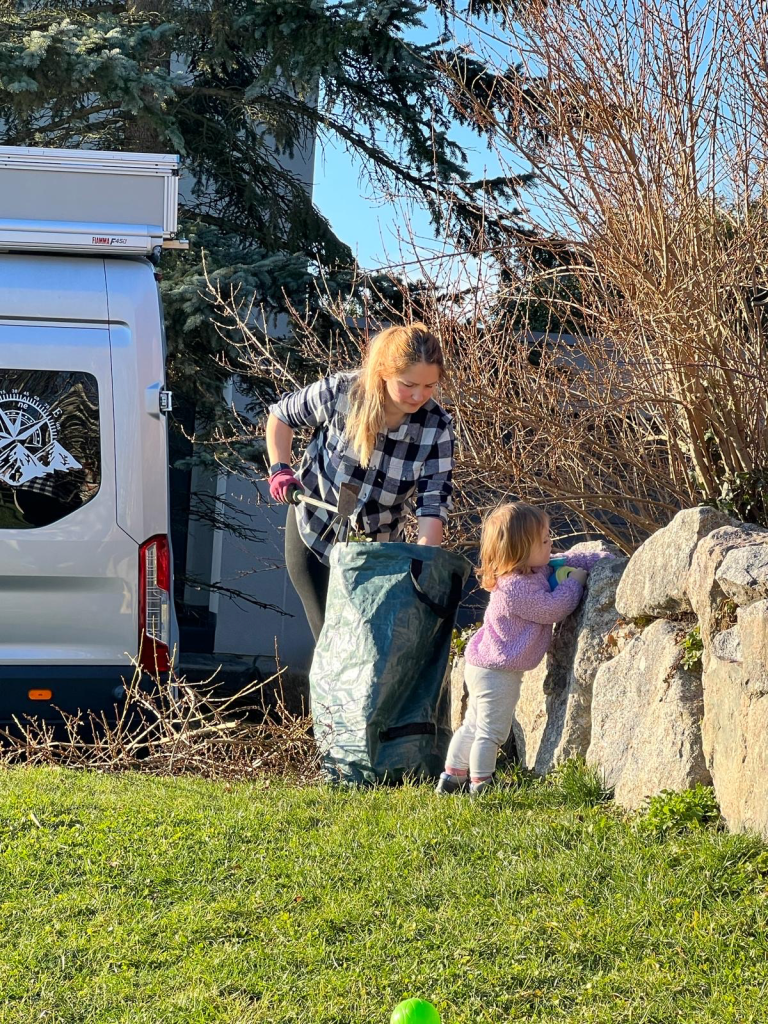 Mom and daughter are gardening on the first sunny day. 