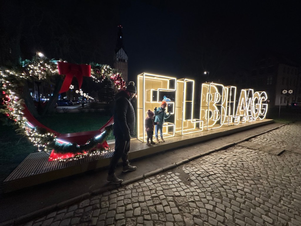 Led sign of Elblag with lit up letters and a heart composition perfect for keepsake photoshoot as a background. 